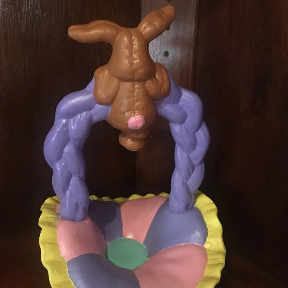 Ceramic Easter bunny hanging from basket